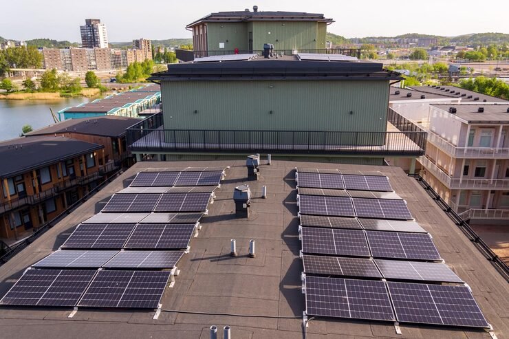 solar-panels-roof-apartment-housing-building-with-gothenburg-city-center-background-sweden-renewable-green-sustainable-energy-concept_709047-3088